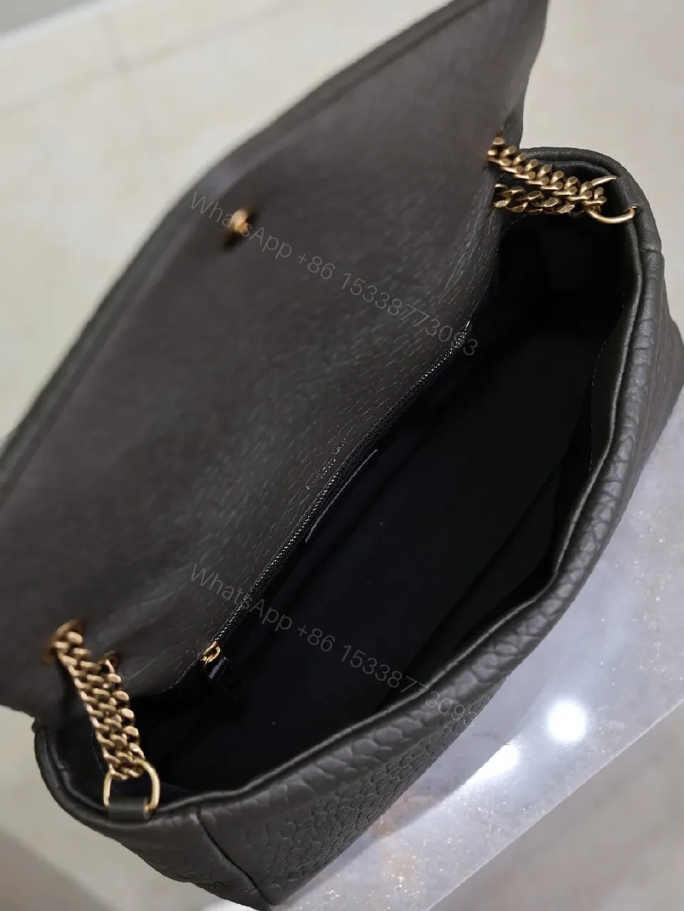 View 7 of Textured Leather Envelope Bag: Black + Gold Accent, Compact Luxury Shoulder Bag