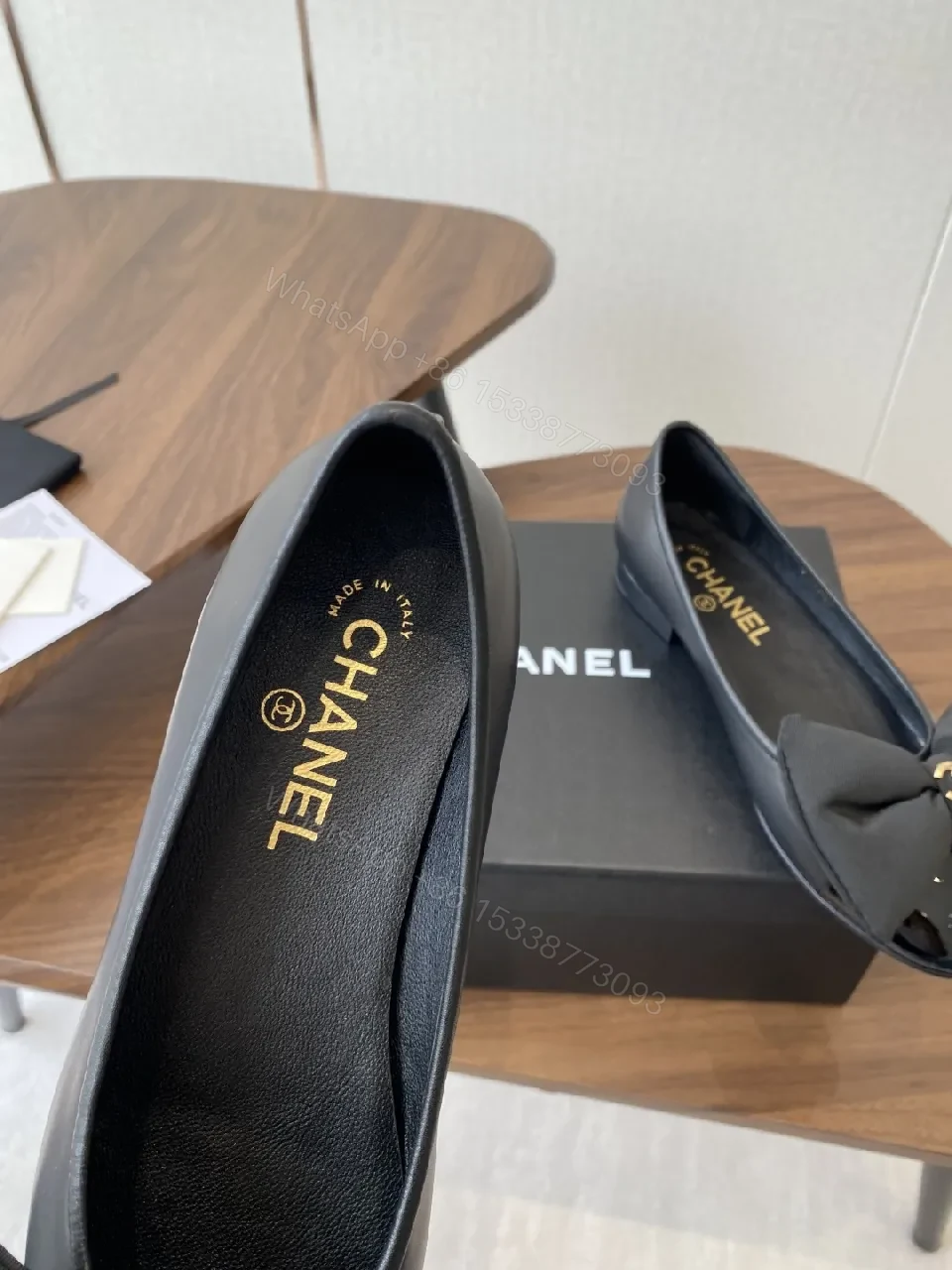View 9 of Lux Black Leather Bow Flats with Gold Hardware