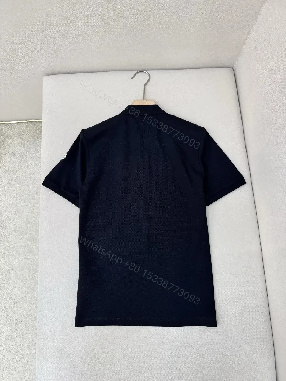 View 5 of Navy cotton polo shirt with red-white striped shoulder accents for everyday luxury