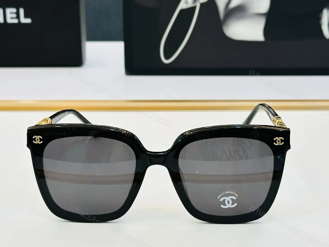 View 5 of Bold Black Frame Sunglasses with Gold Detailing