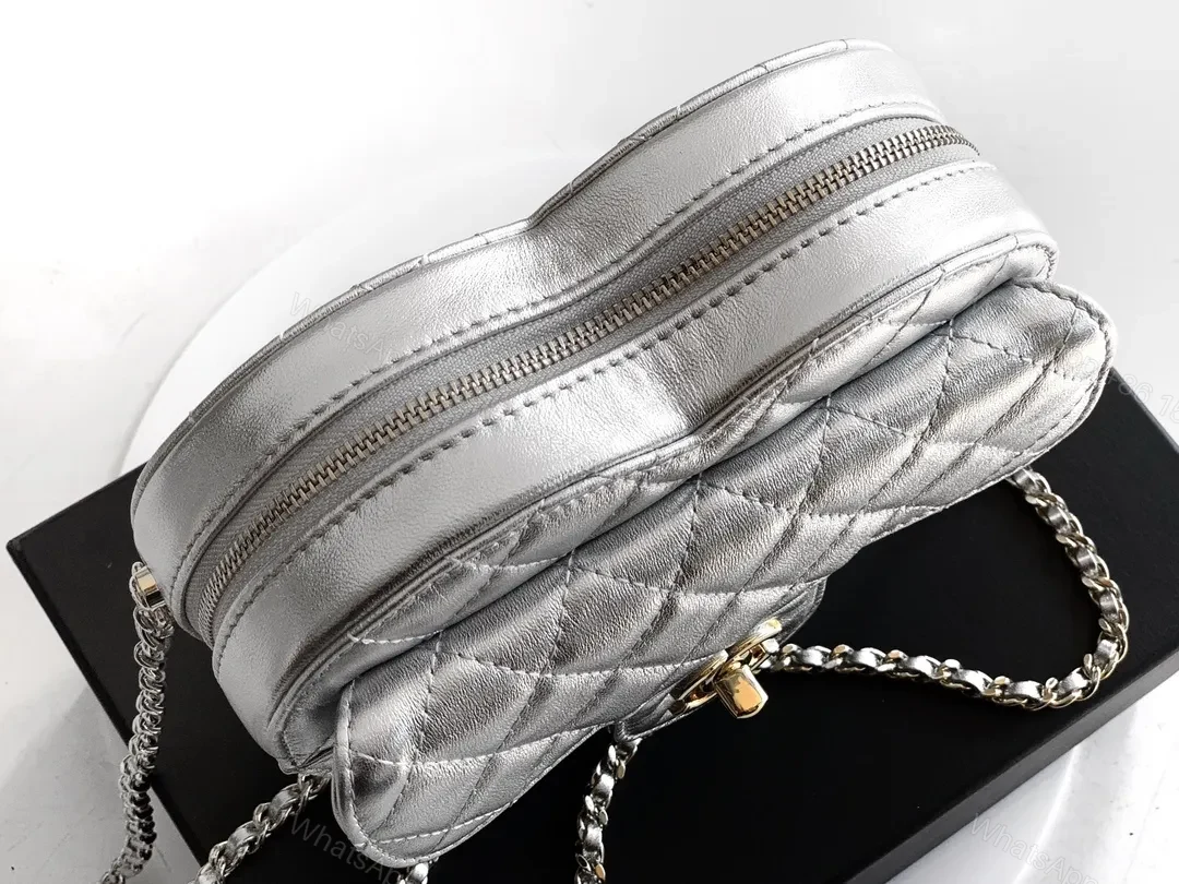 View 3 of Heart-Shaped Quilted Metallic Bag with Gold Hardware