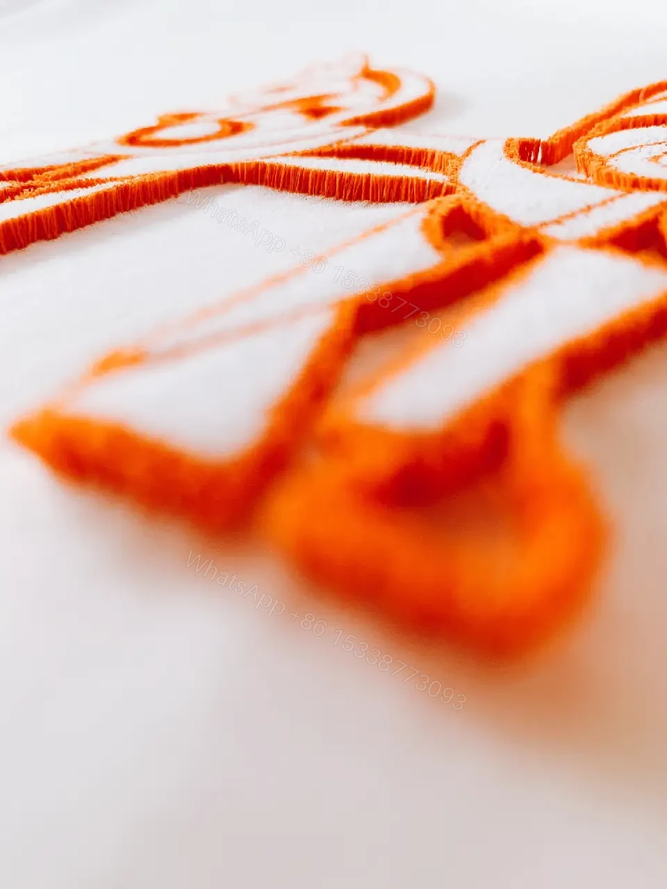 View 7 of Minimalist White Tee with Bold Orange Emblem T-Shirt
