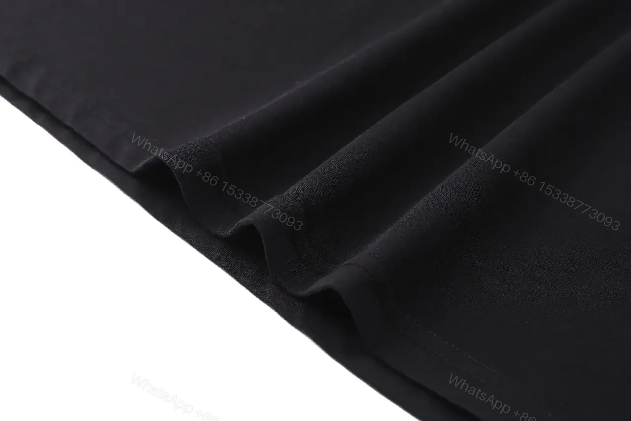 View 9 of Minimalist Cotton Crest Tee - Black Luxe Tee