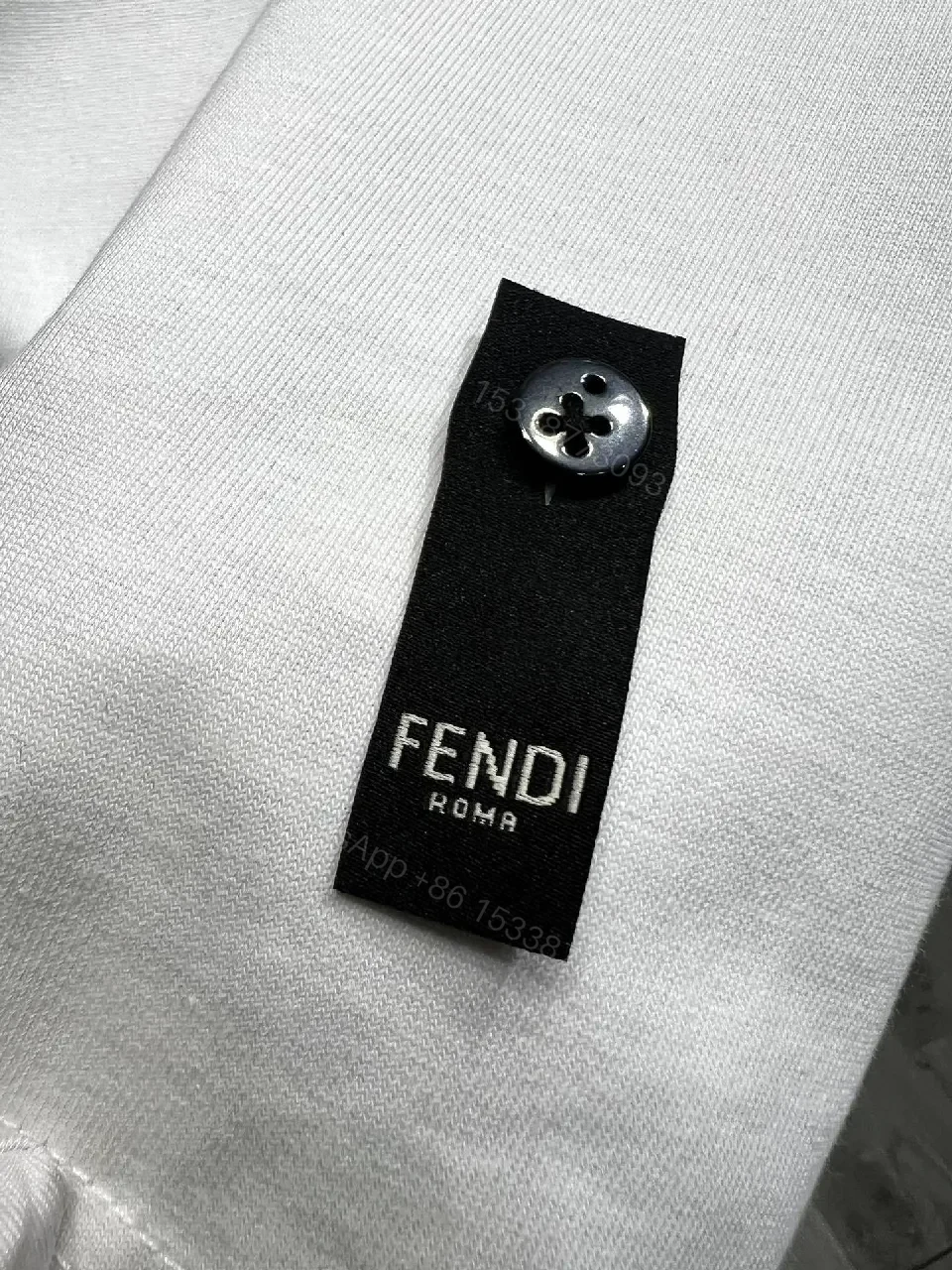 View 10 of White Cotton Tee: Bold Fendi Logo, Minimalist Luxe Crewneck