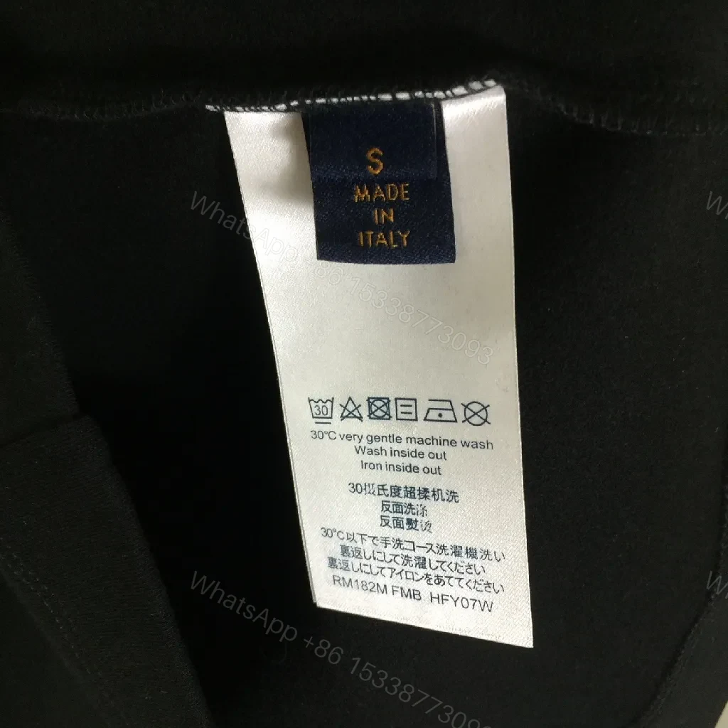View 4 of Minimalist Black Sweatshirt with Subtle Monogram Accent