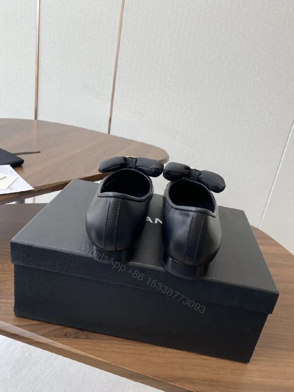 View 7 of Lux Black Leather Bow Flats with Gold Hardware
