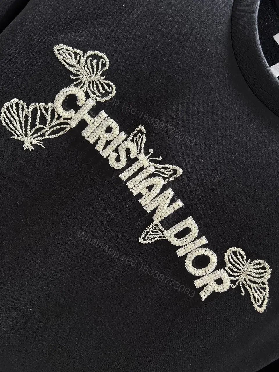 View 8 of Black Cotton Tee with Subtle Embroidered Logo - Luxury Everyday Wear
