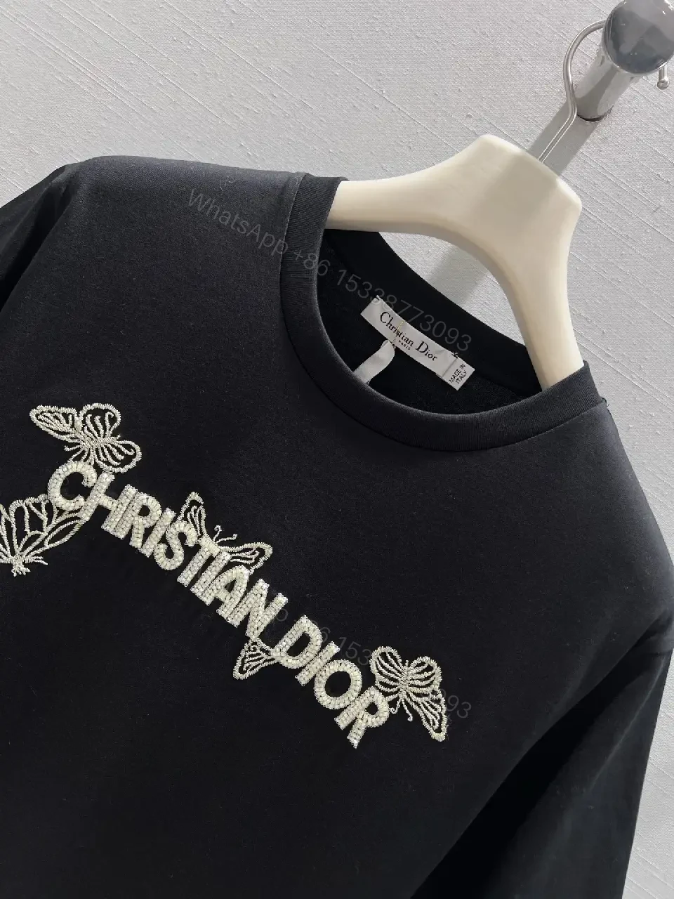 View 2 of Black Cotton Tee with Subtle Embroidered Logo - Luxury Everyday Wear