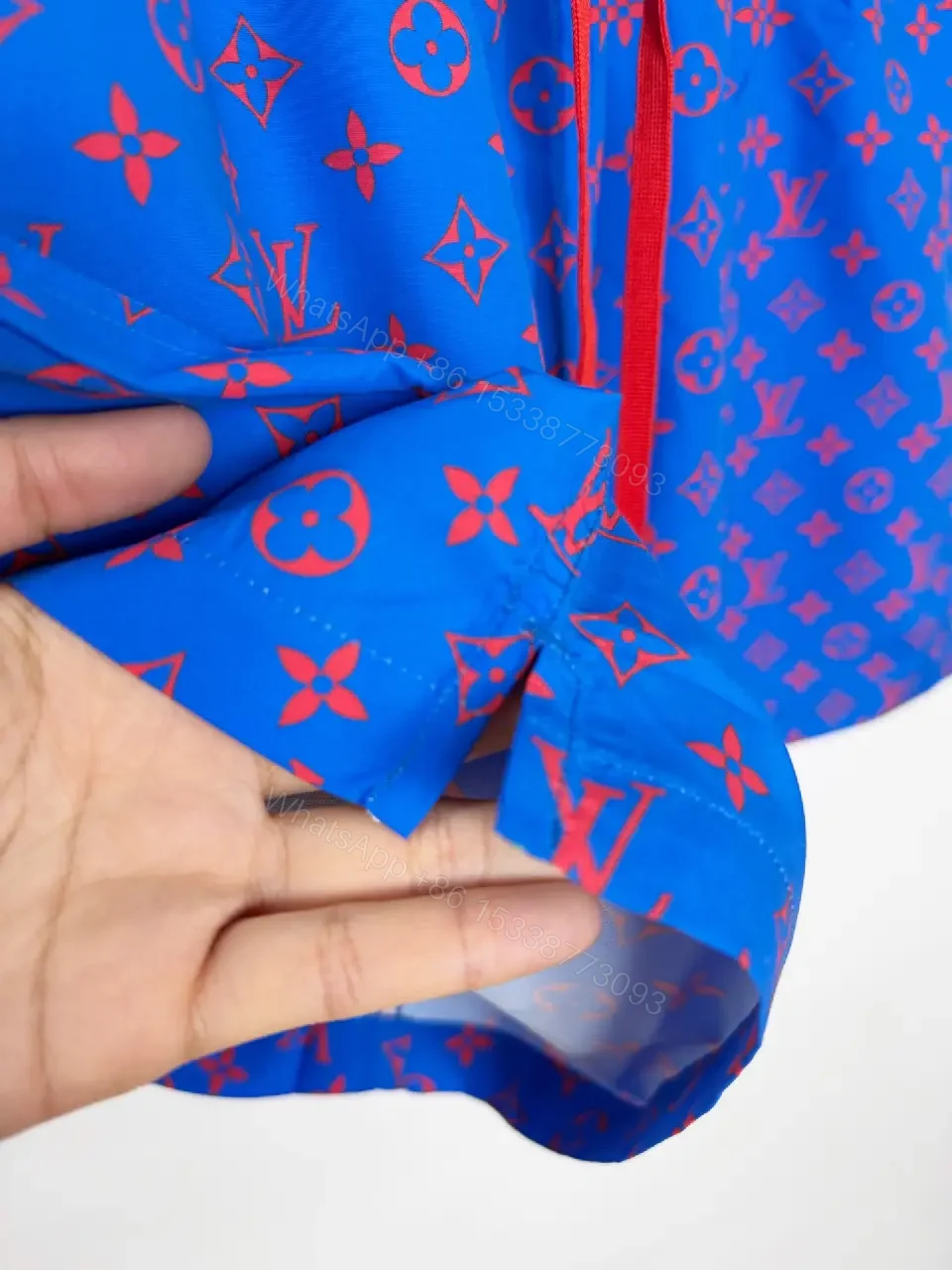 View 3 of Blue Louis Vuitton Monogram Swim Shorts with Red Drawstring