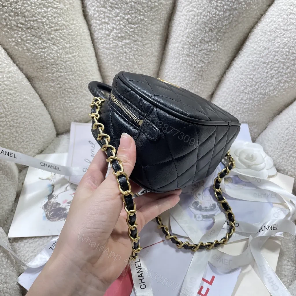 View 7 of Compact Black Quilted Handbag with Gold Logo Chain