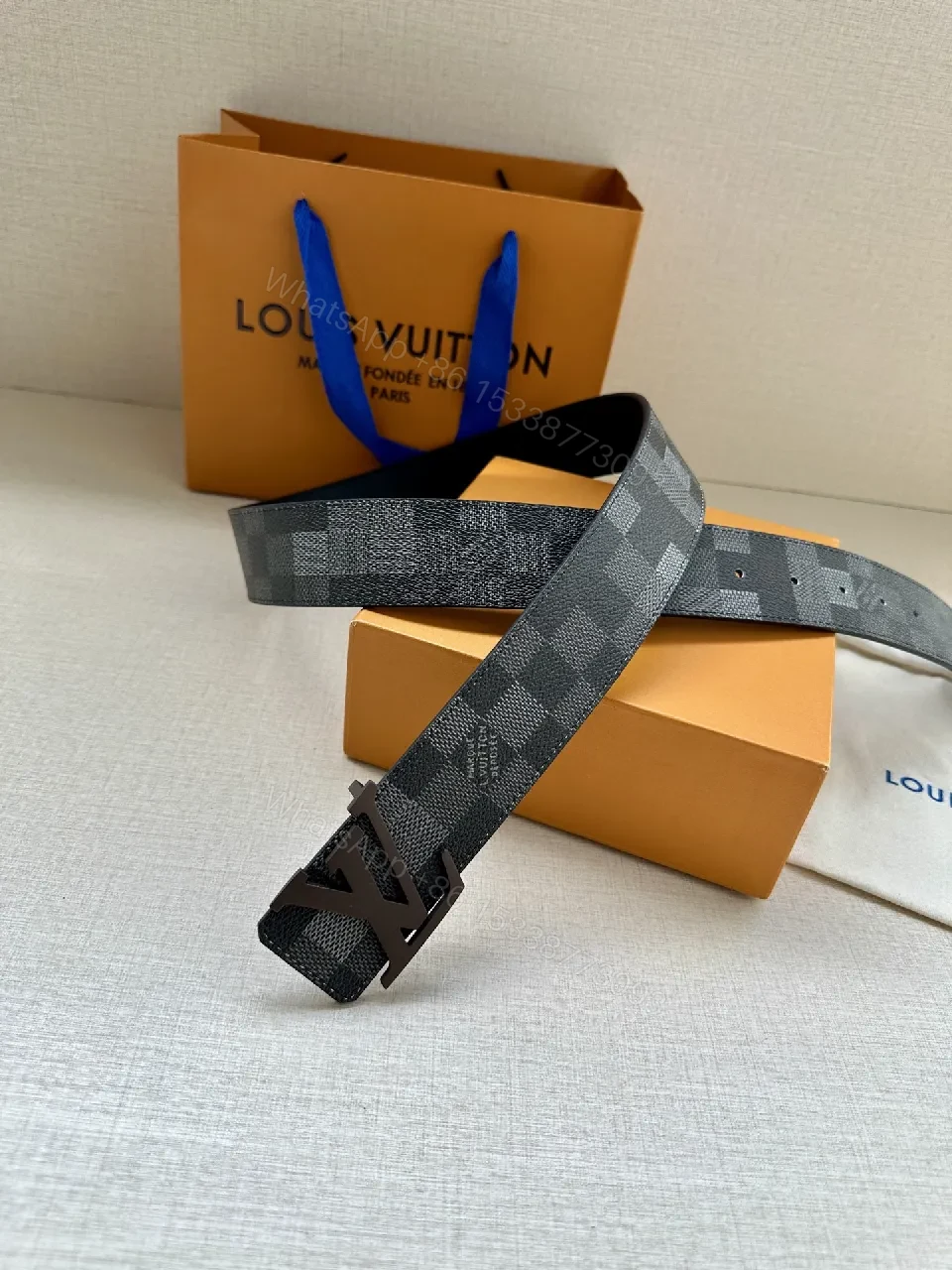 View 2 of Checkerboard Leather Belt with Gunmetal Buckle, Unisex Style