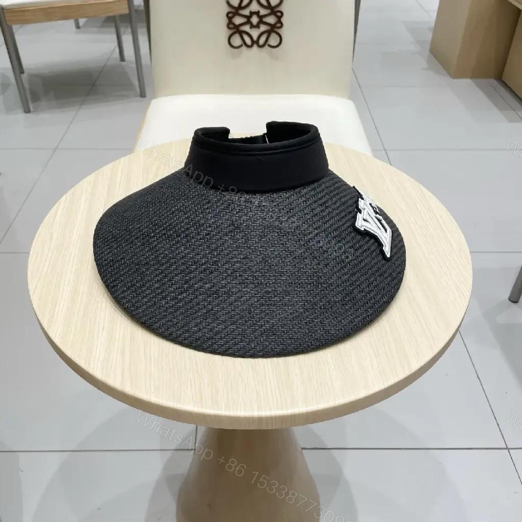 View 3 of Bold Sun Visor with LV Flair: Luxury-Casual Headwear