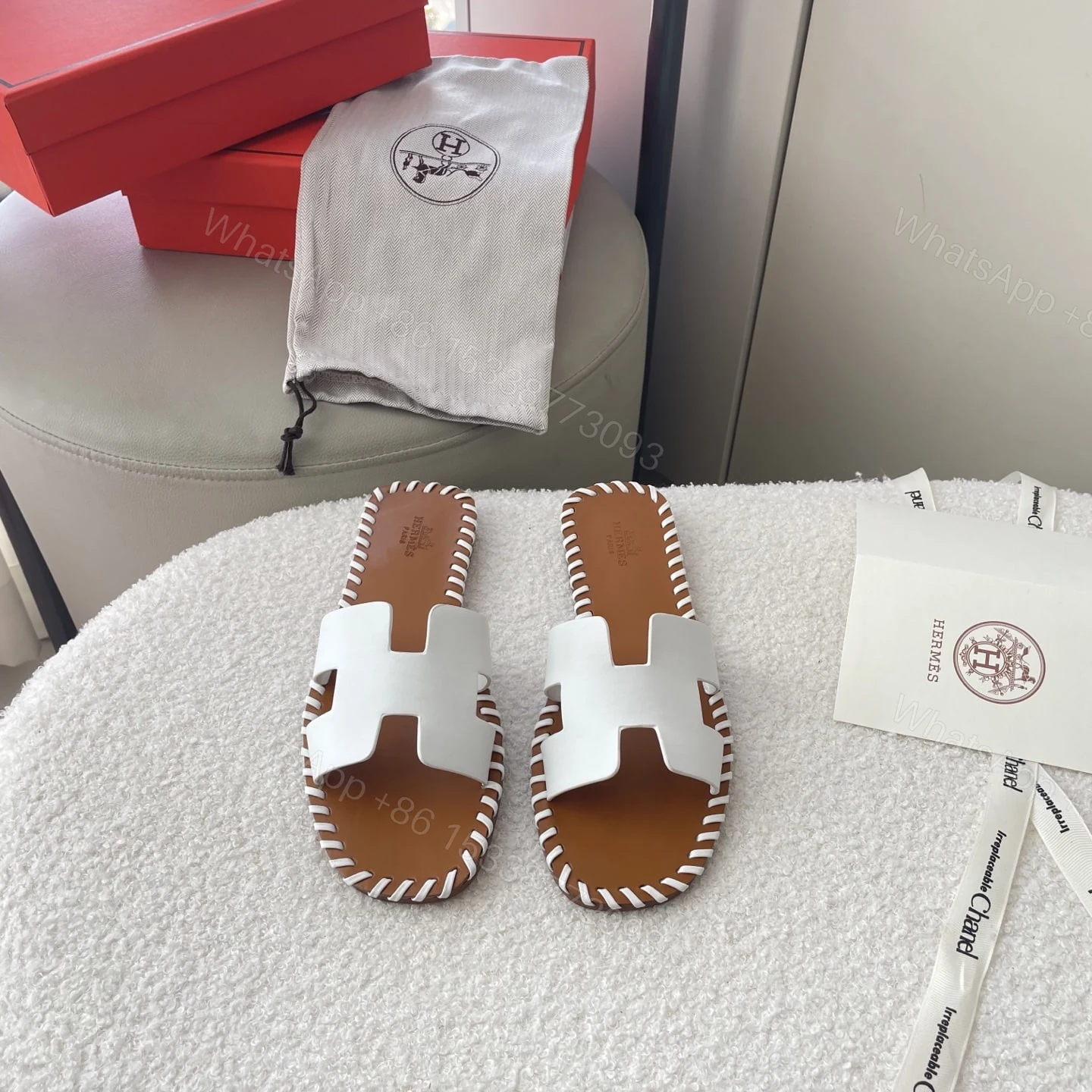 View 2 of HERMÈS ORAN SANDALS STITCHING IN BROWN AND WHITE
