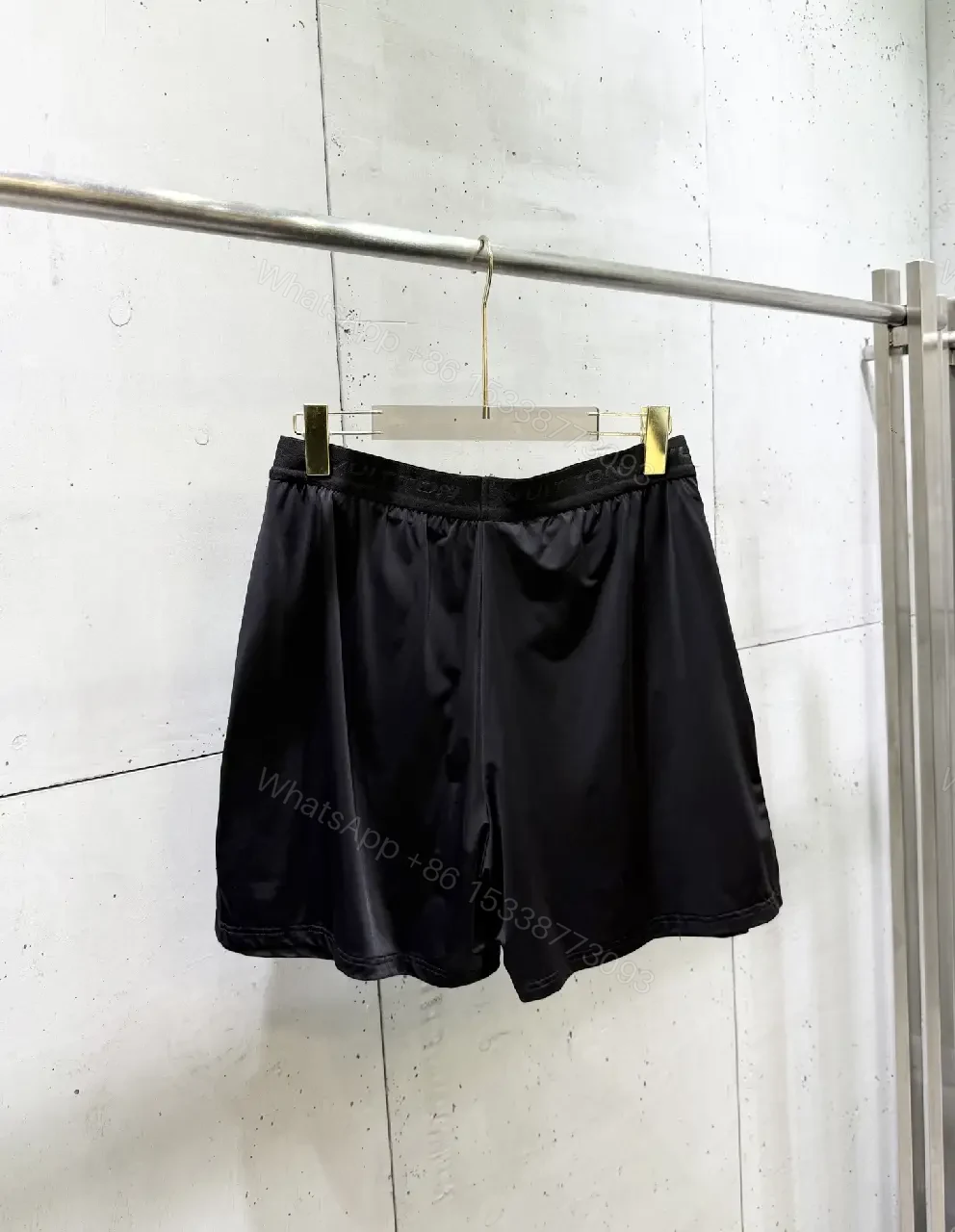View 2 of Matte Black Quick-Dry Shorts with Subtle LV Detailing