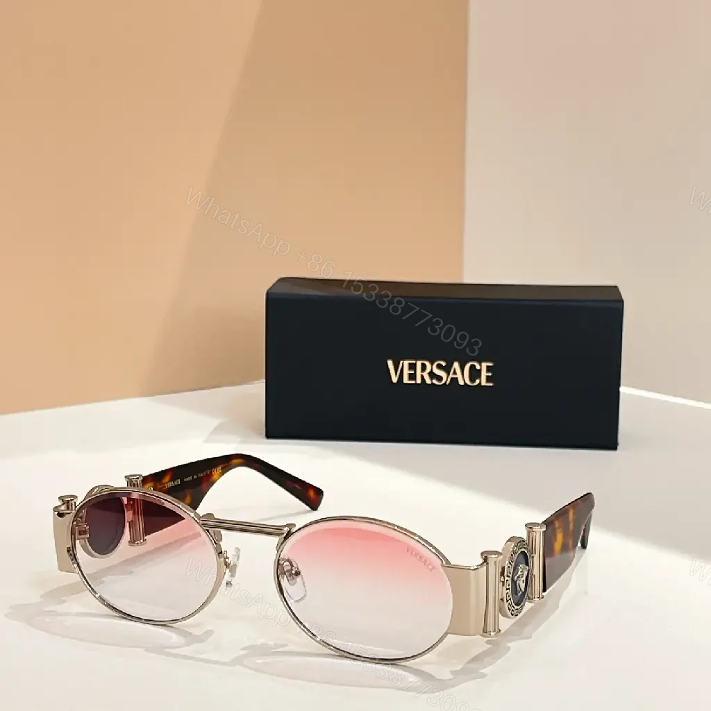 View 2 of Amber-Tinted Round Sunglasses: Gold-Accent, Sculpted Hardware, UV400 Shield