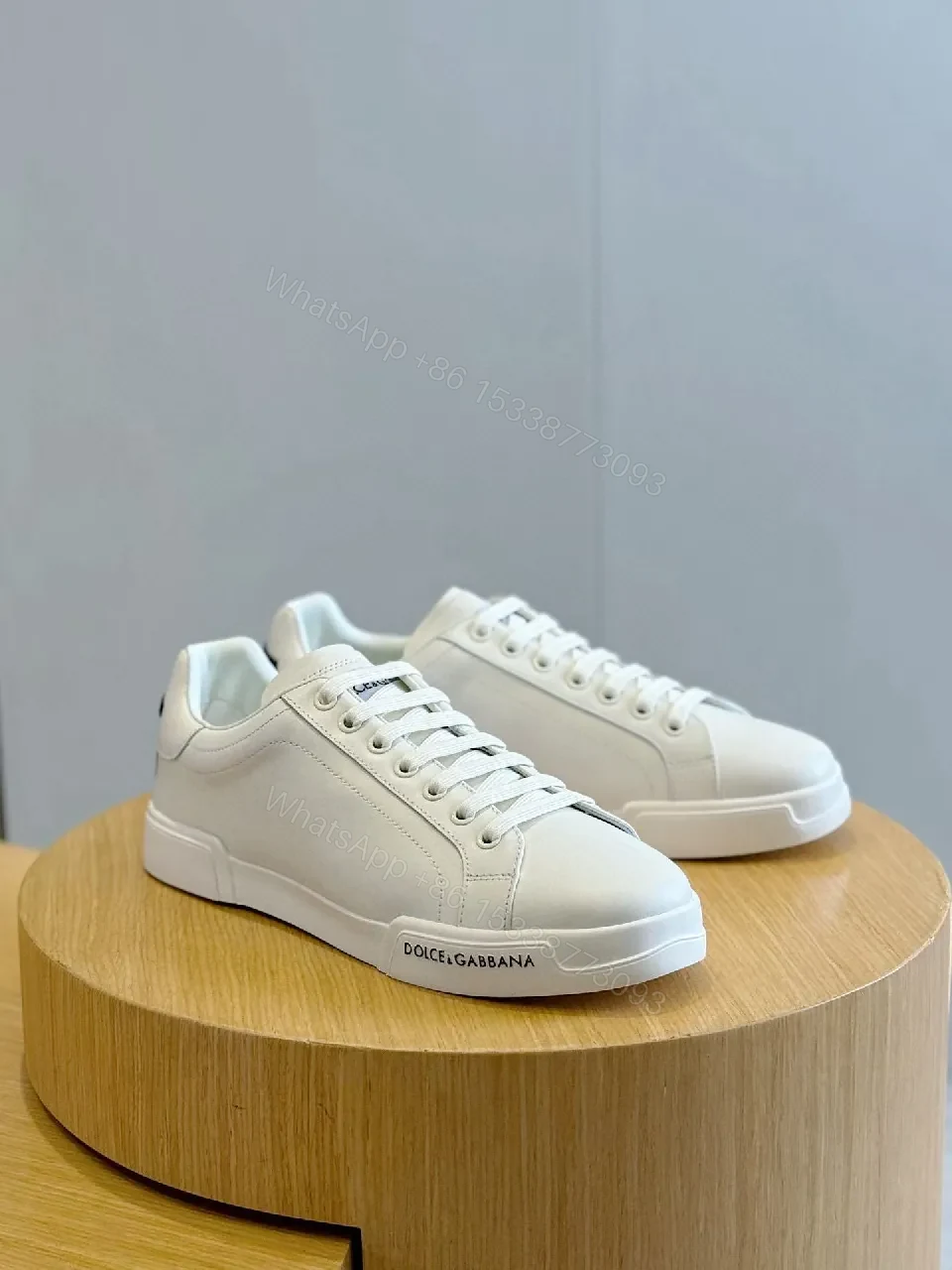 View 3 of Minimal White Leather Sneakers with Subtle Designer Detailing