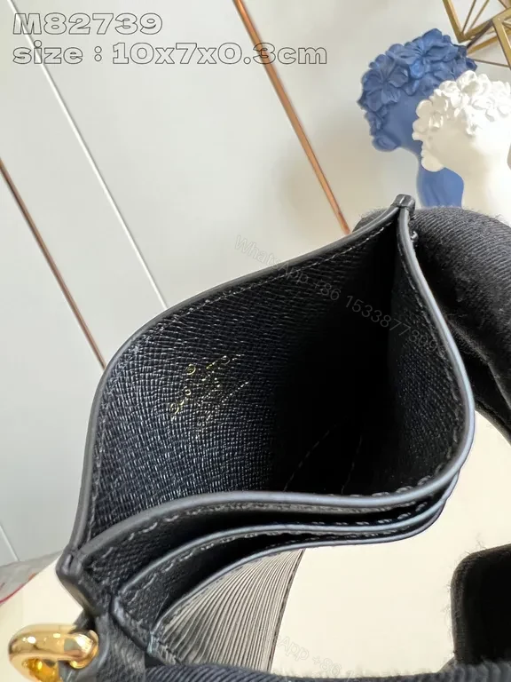 View 3 of Compact Black Textured Wallet with LV-Style Logo Details