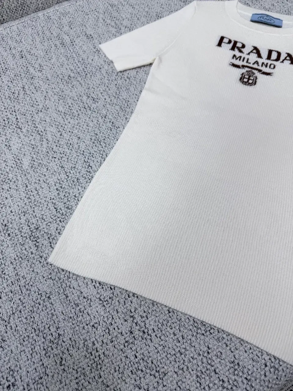 View 6 of Minimalist Ivory Knit Tee with Prominent Branding