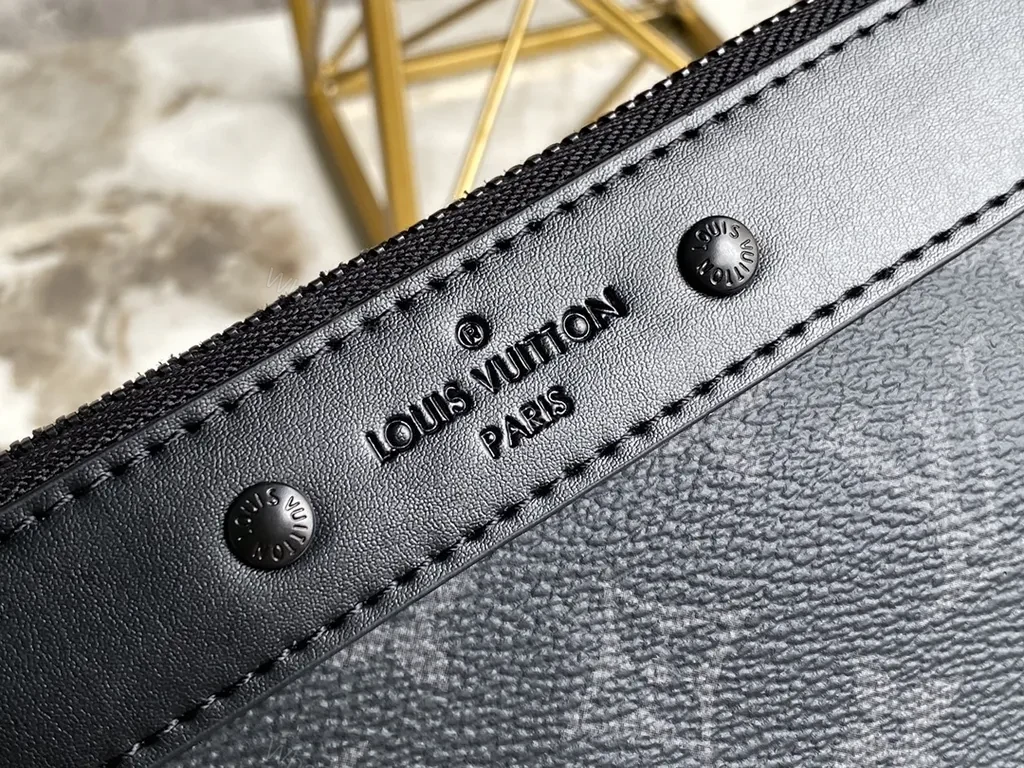 View 6 of Dark Monogram Clutch: Luxe Black Canvas, Leather Trim, Wrist Strap