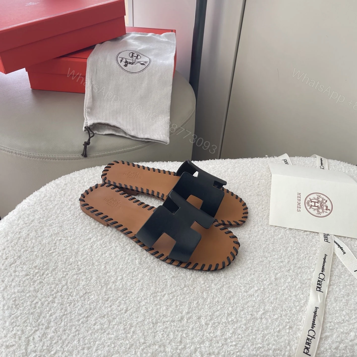 View 2 of HERMÈS ORAN SANDALS STITCHING IN BLACK AND BROWN