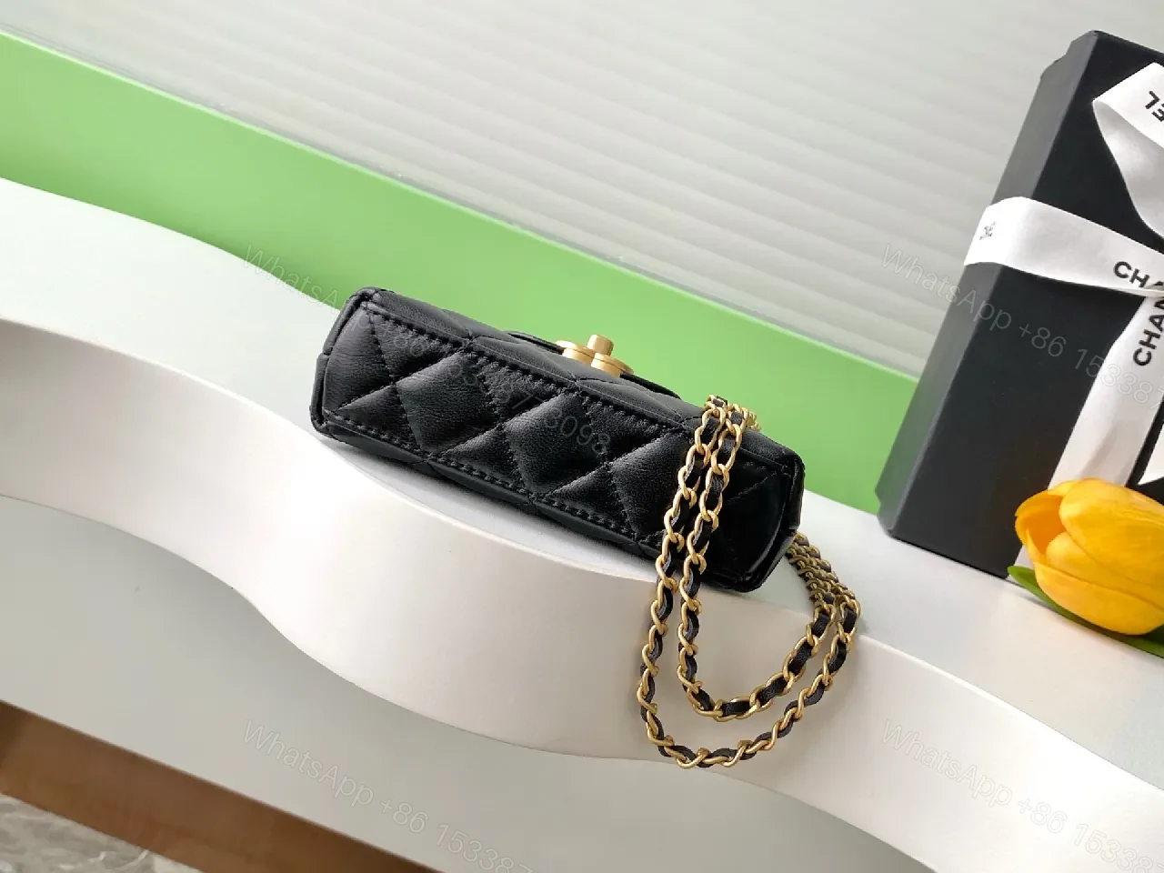 View 8 of Black Quilted Mini Handbag with Gold Hardware, Chain Strap