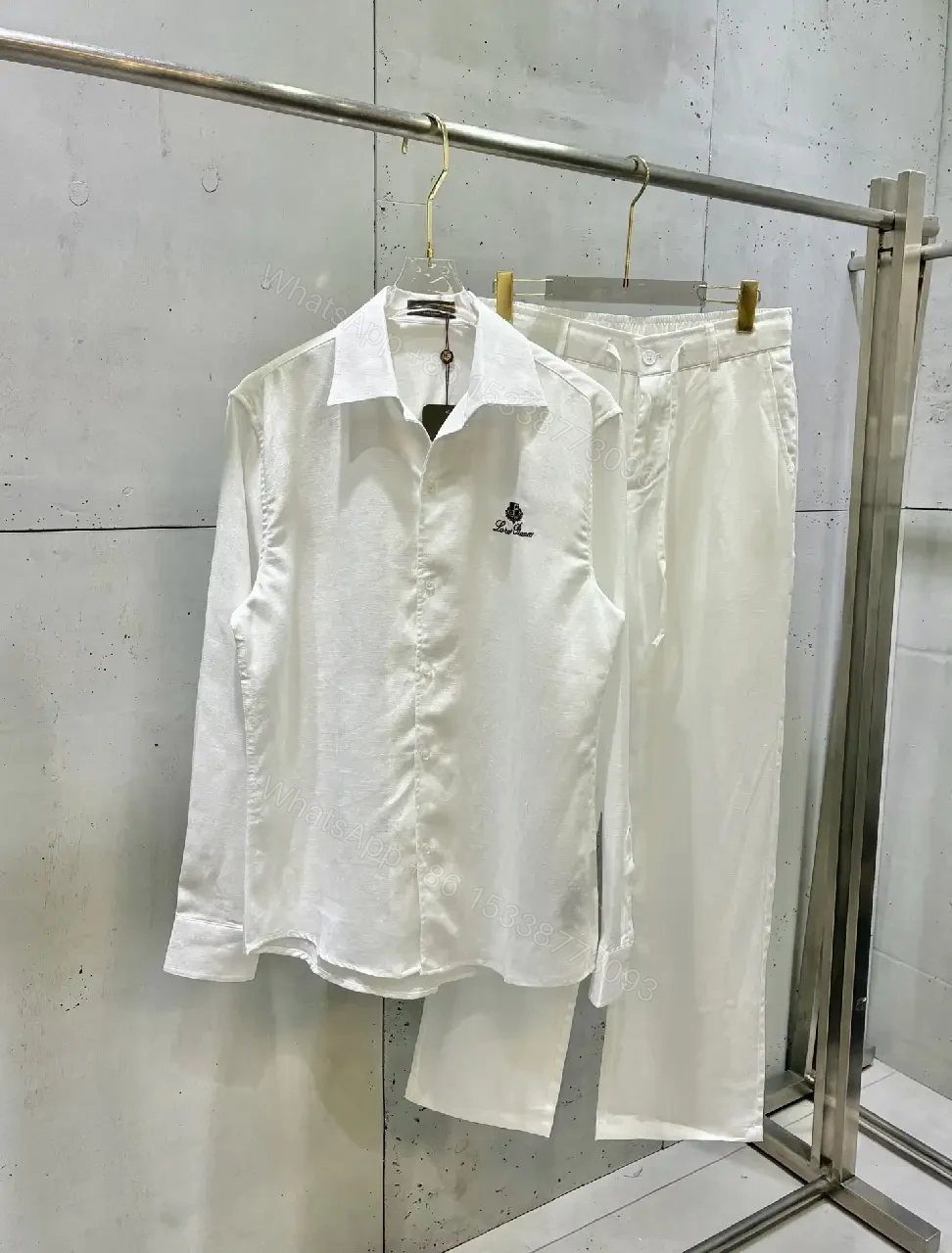 View 4 of Off-White Cream Wide-Leg Trousers with High Waist and Front Fly Closure