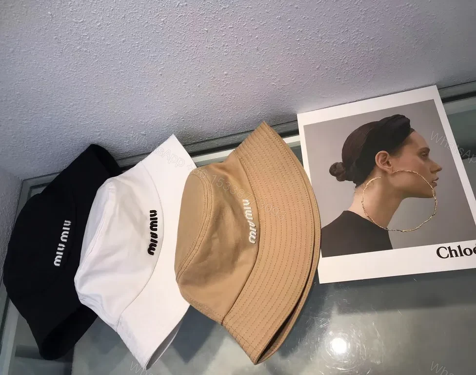 View 4 of Crisp White Miu Miu Bucket Hat: Iconic Logo Shield
