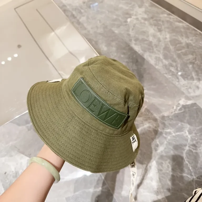 View 8 of Olive Canvas Bucket Hat: Subtle Luxury, LOEWE Patch