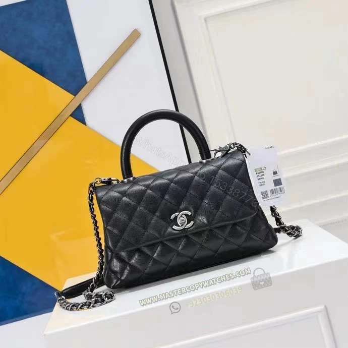 Chanel Mini Flap with Top Handle in Black — view 1