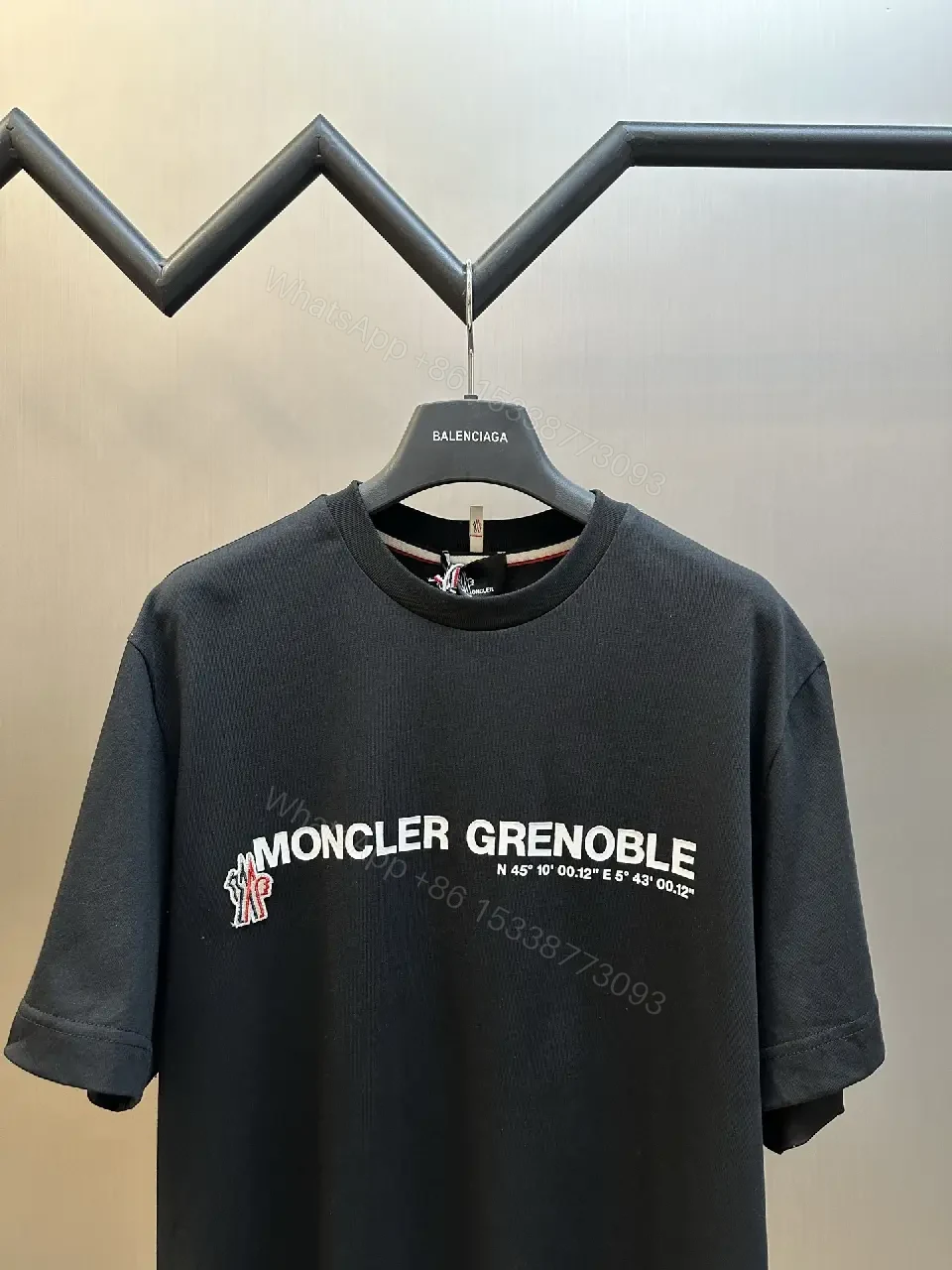 View 5 of Minimalist Black Tee with Logo Crest, Relaxed Fit, Premium Cotton
