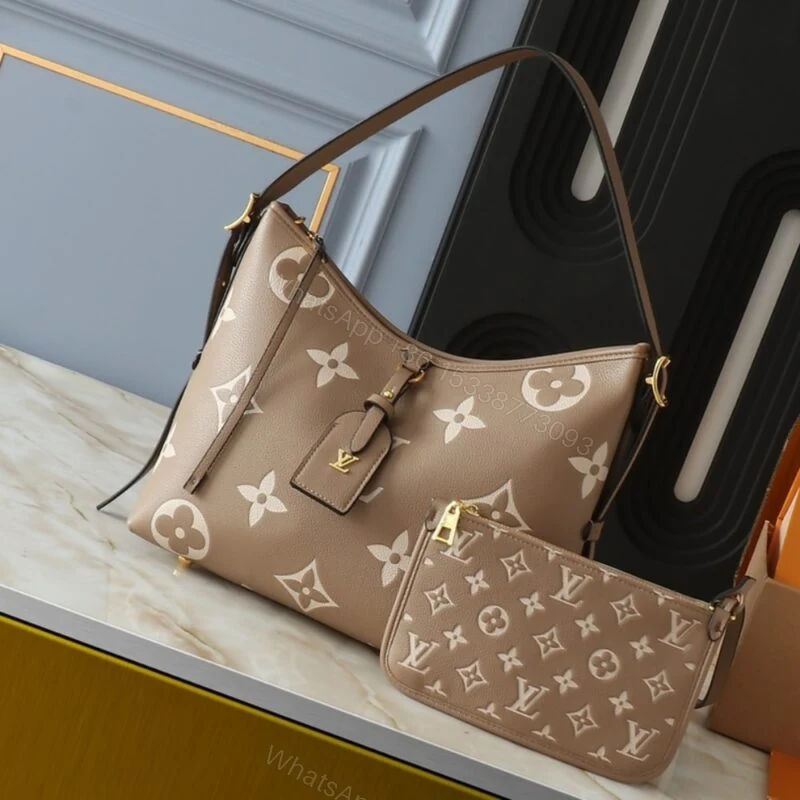 View 2 of Louis Vuitton Carryall PM Bicolor Monogram Empreinte Dove And Cream 29Cm M47180