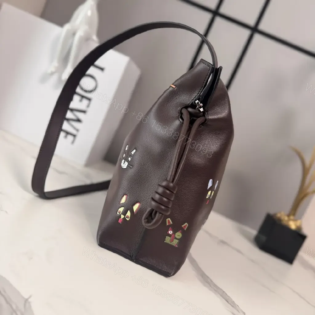 View 4 of Dark Leather Crossbody: Playful Animal Motifs, Compact Chic