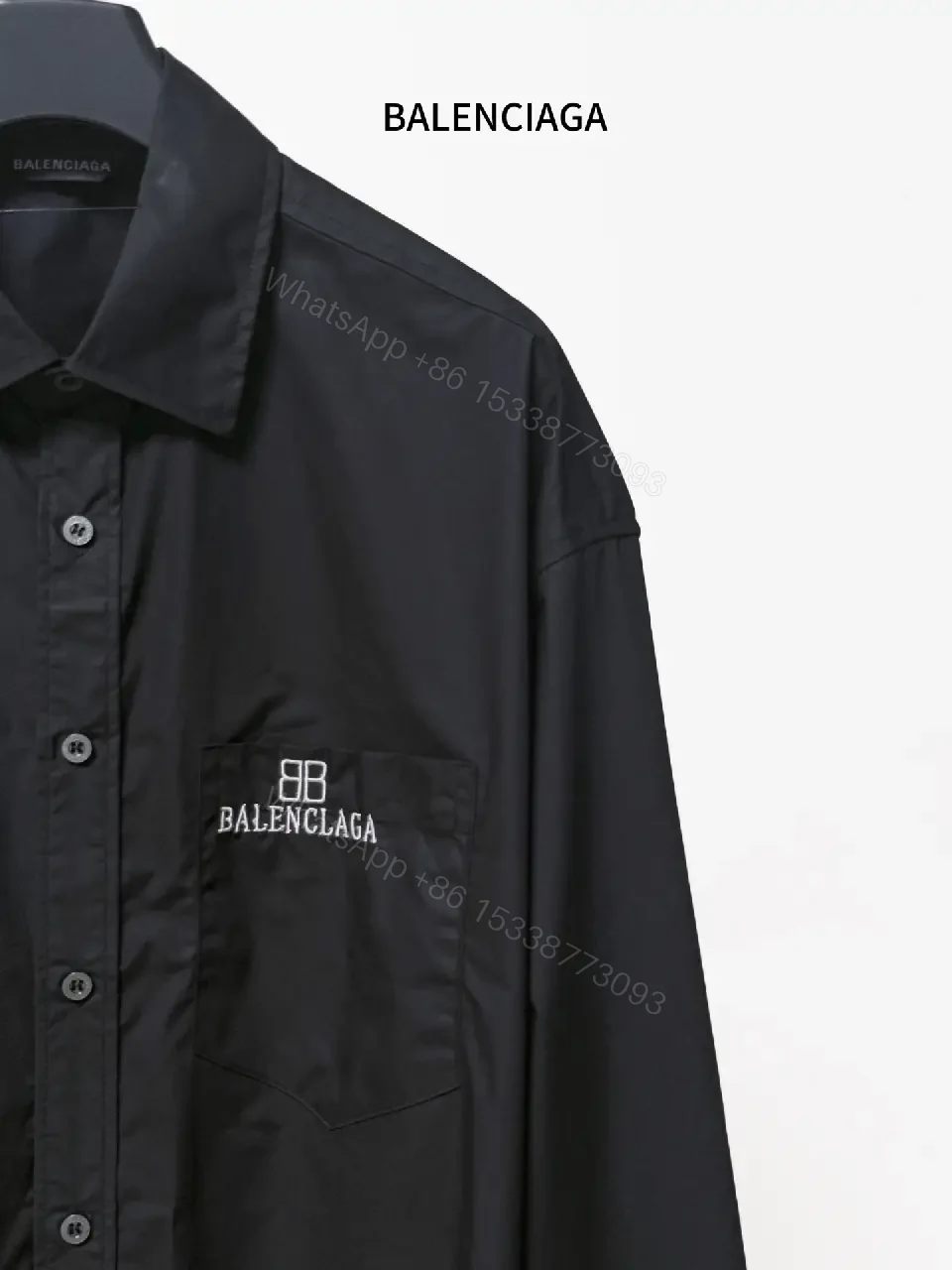 View 7 of Structured Minimalist Button-Front Shirt with Subtle Crest, Black