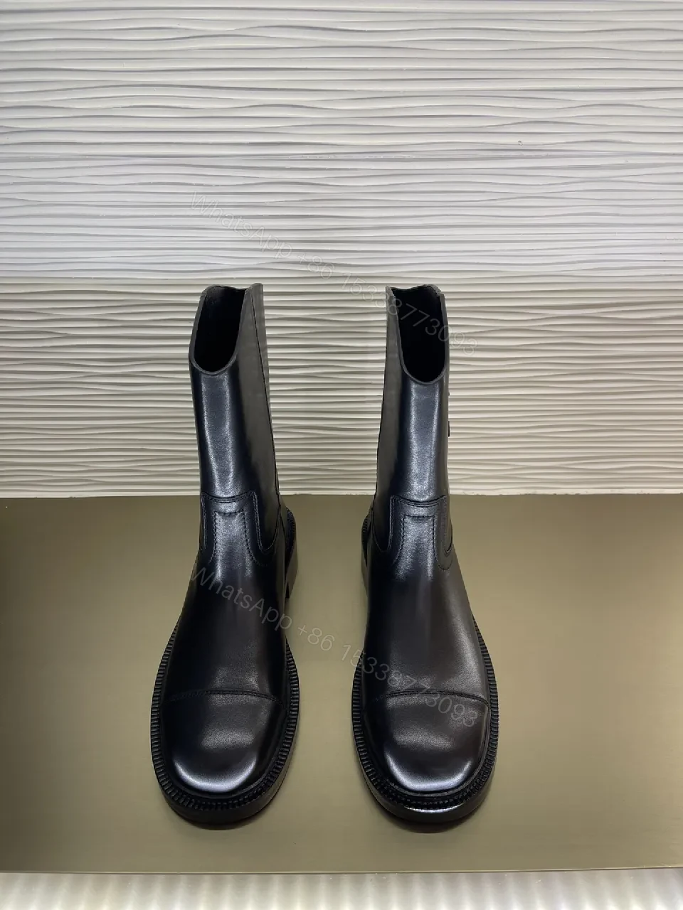 View 4 of Chic Black Leather Knee-High Boots with Logo Embellishment