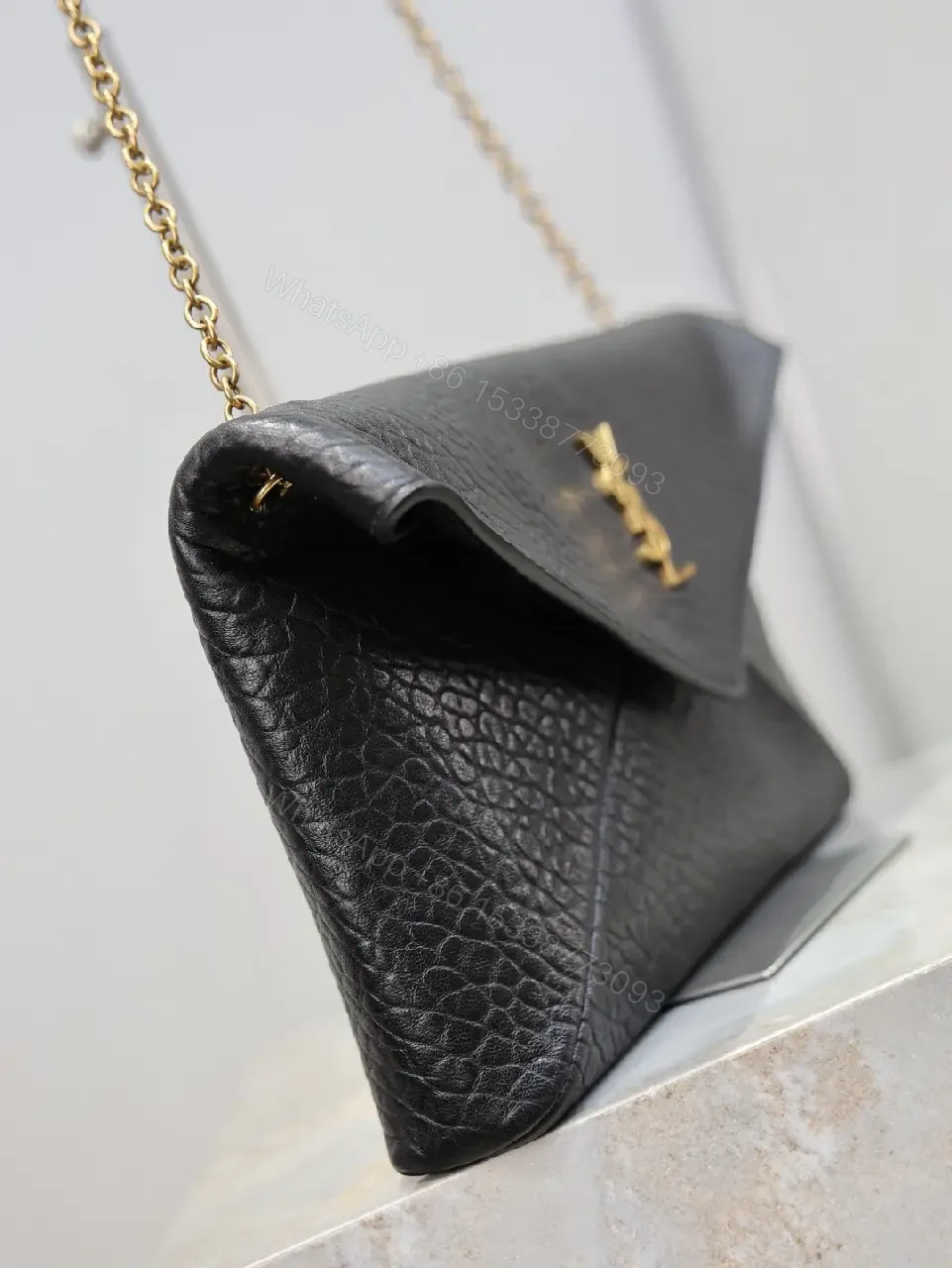 View 9 of Pebbled Leather Envelope Flap Bag, Gold Logo, Day-to-Night Versatility