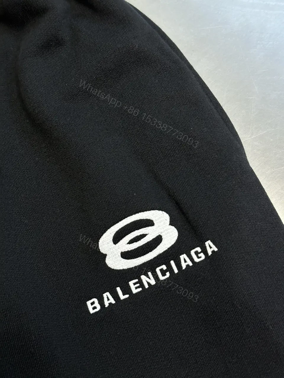 View 5 of Chic Black Wide-Leg Track Pants with Subtle Logo