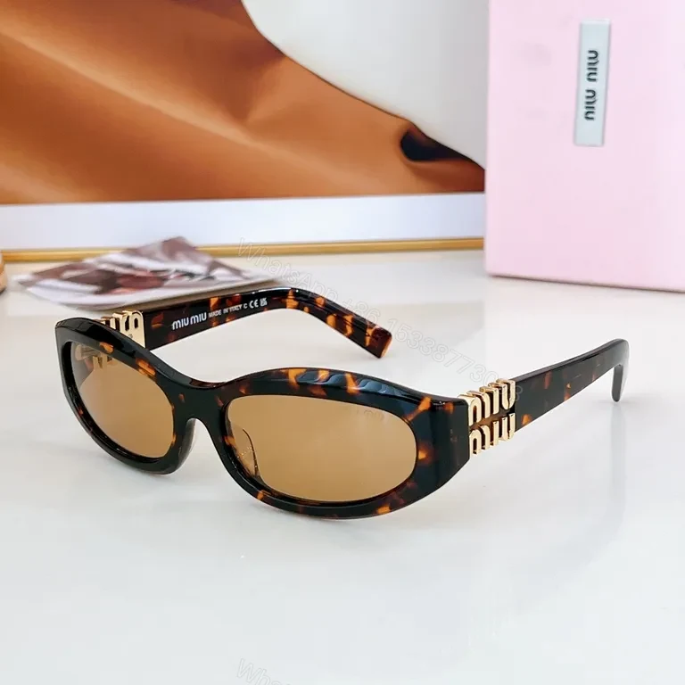 View 7 of Chic Black Miu Miu Sunglasses with Gold Accent - All-Day Shield