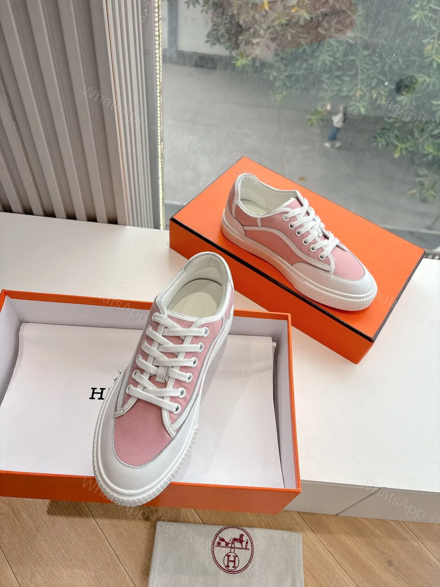 View 3 of Hermes Women Pink Canvas And White Leather Sneakers