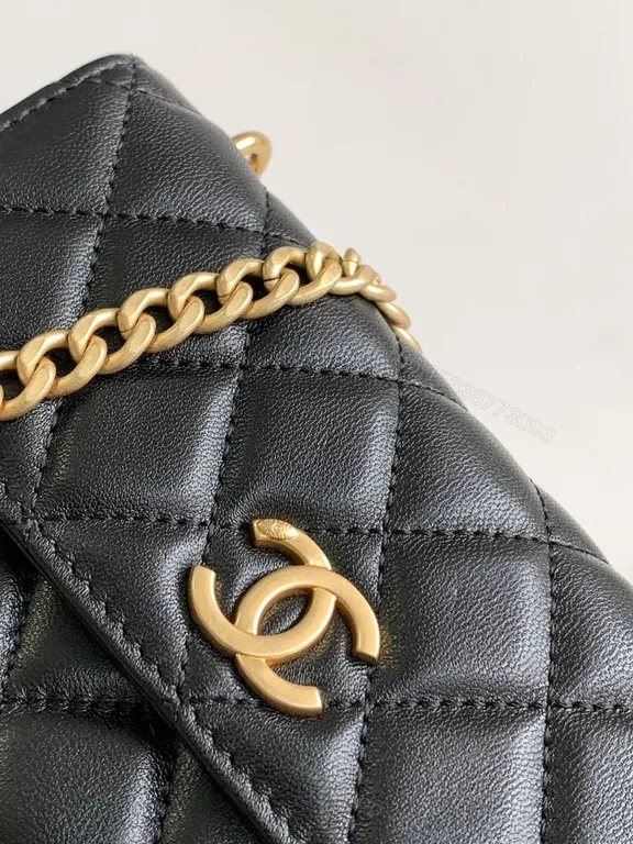 View 9 of Mini Quilted Black Chain Bag with Gold Logo â€” Luxury Silhouette