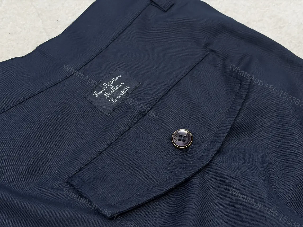 View 3 of Navy Cargo Shorts with Louis Vuitton Logo Embossed Key Features Short