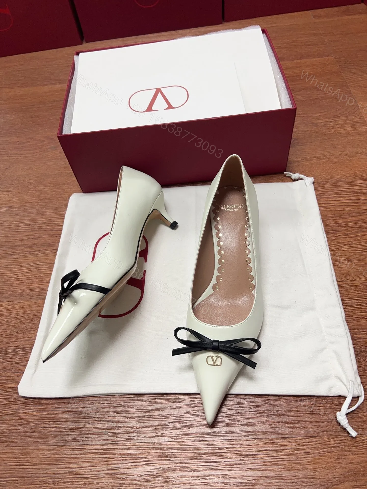 View 3 of Valentino Women Ivory Leather Bow Accent Pumps