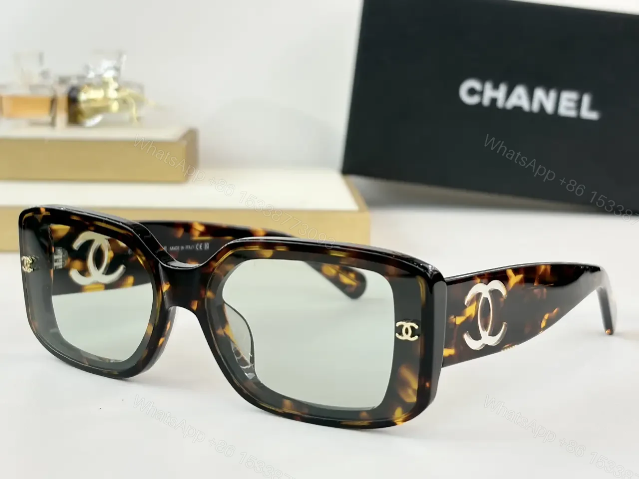 View 5 of Bold Black Acetate Rectilinear Sunglasses, Gold Accents, UV400 Protection