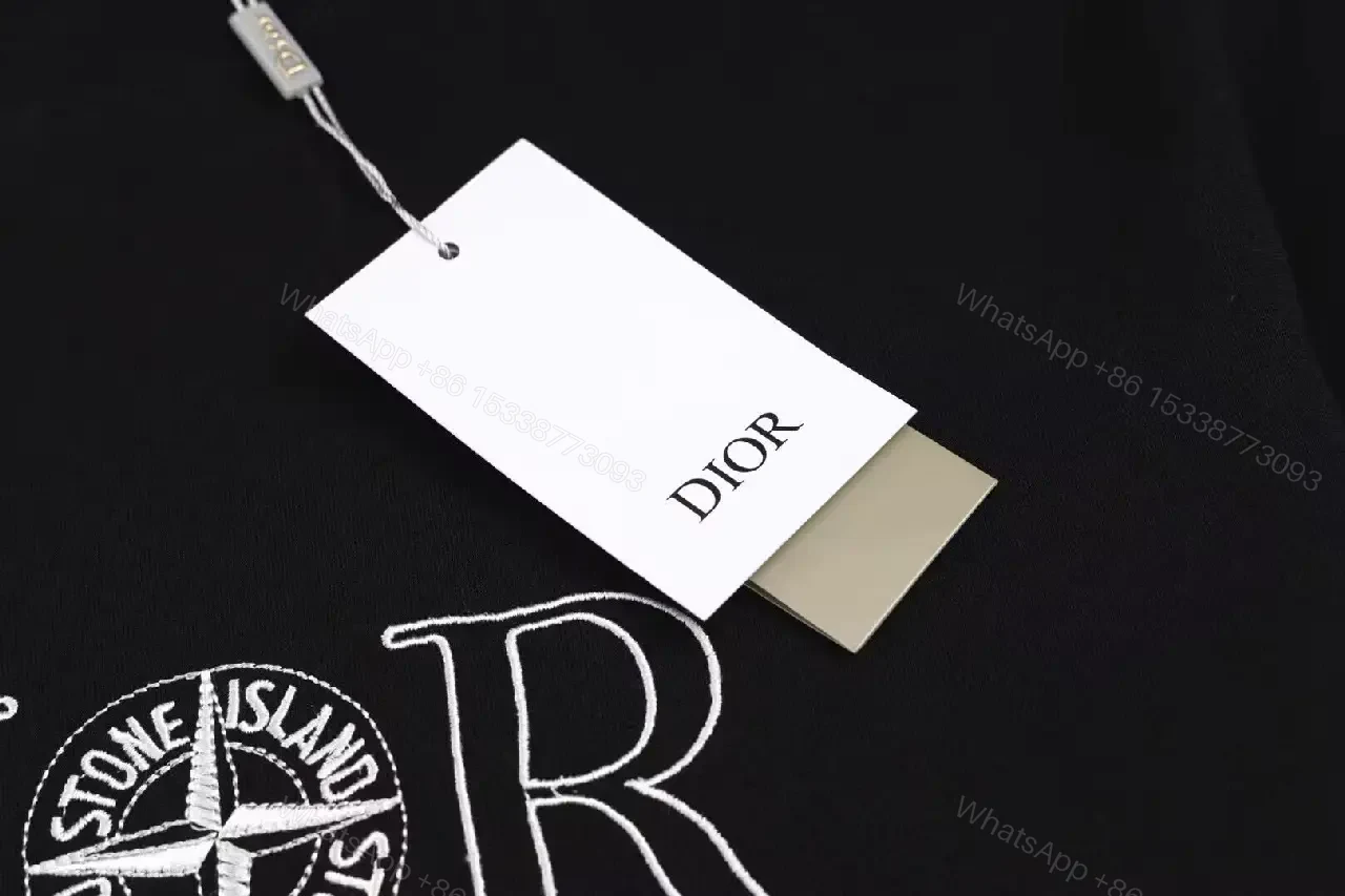 View 4 of Monochrome Black Cotton Twist Tee — Subtle Logo, Luxe Style