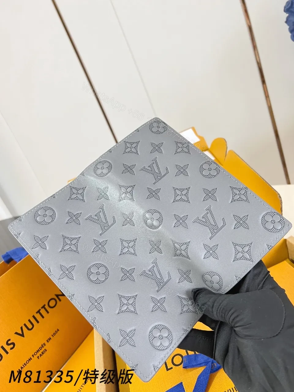 View 4 of Soft Gray Monogram Leather Wallet: Compact Luxury, Signature Detail