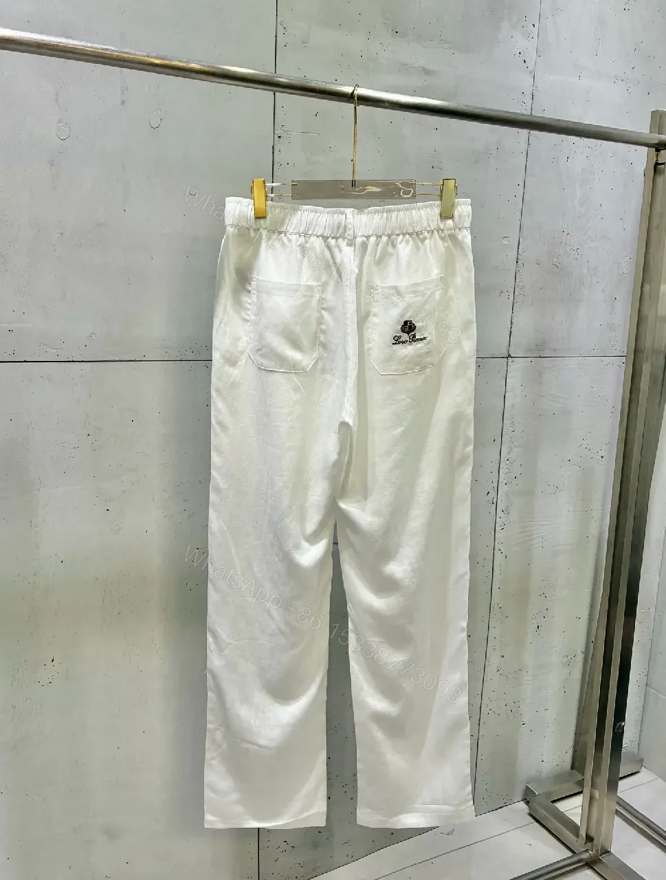 View 7 of Off-White Cream Wide-Leg Trousers with High Waist and Front Fly Closure