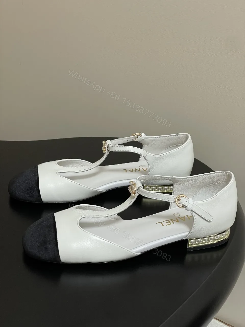 View 7 of White & Black T-Strap Pumps with Pearl Buckle – Luxe Two-Tone Heels
