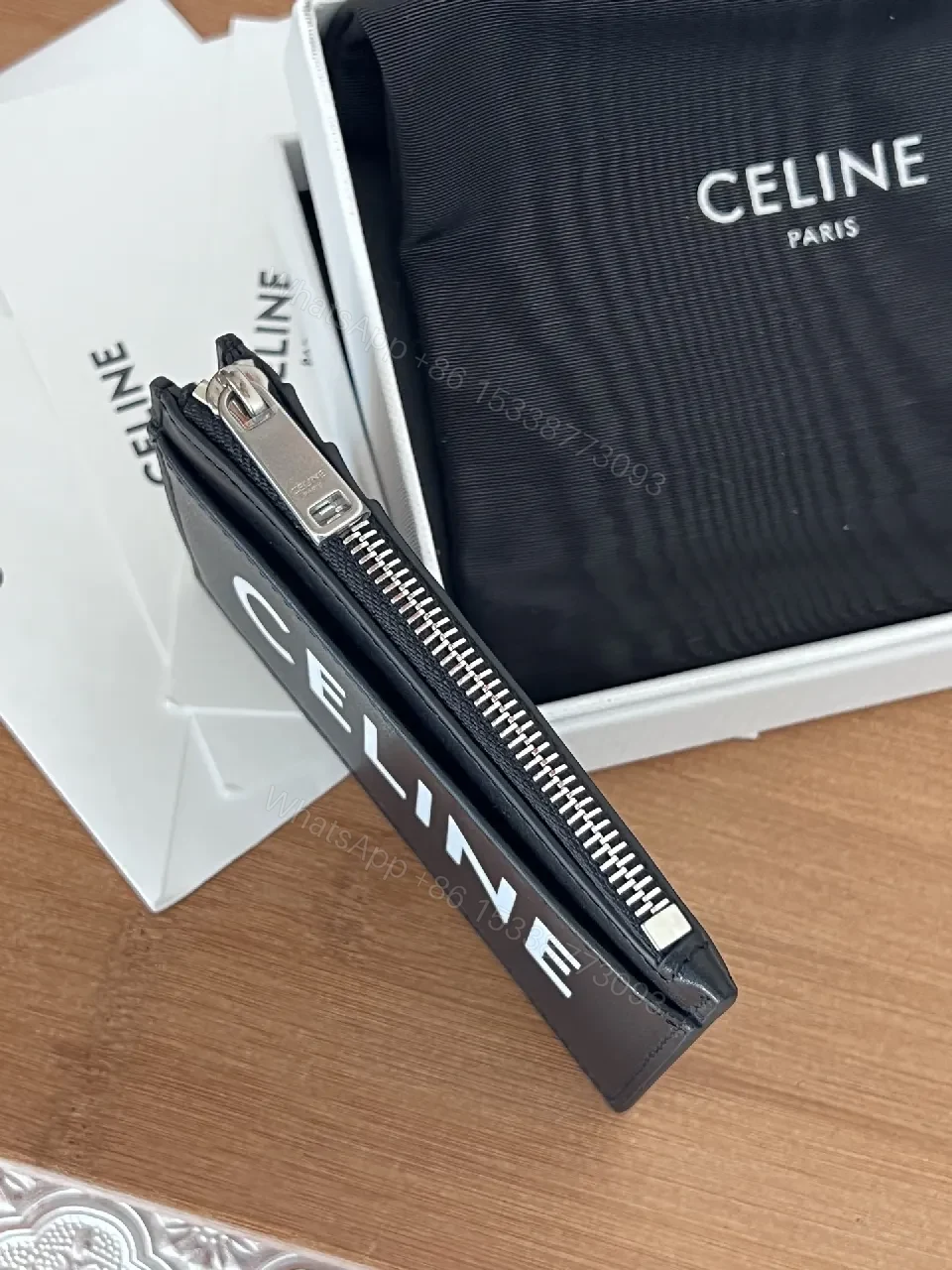 View 5 of Minimalist Black Cardholder: Bold CELINE Print, Compact Luxury