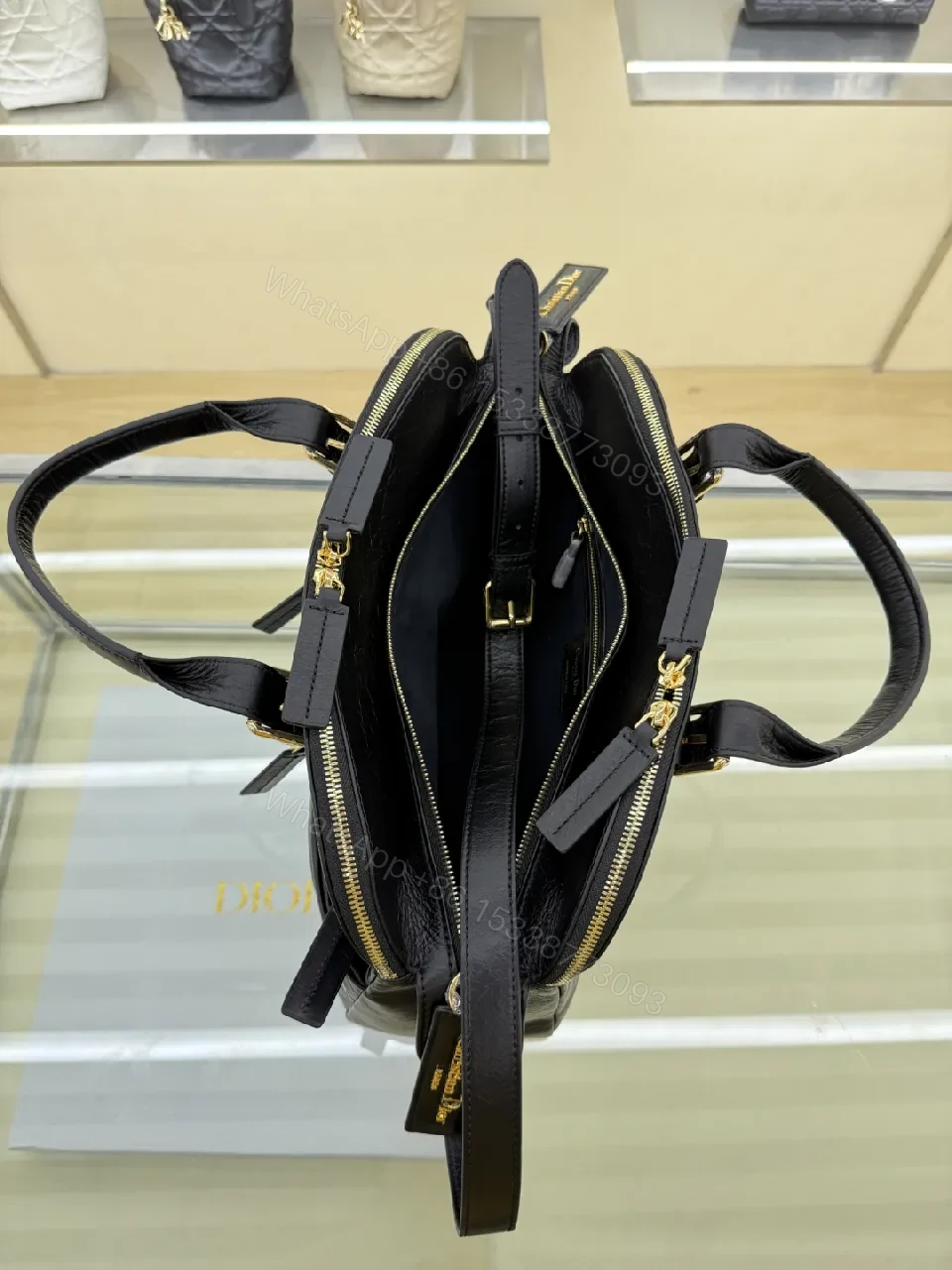 View 4 of Compact Luxury Satchel: Black Leather, Gold Hardware, Structured Style