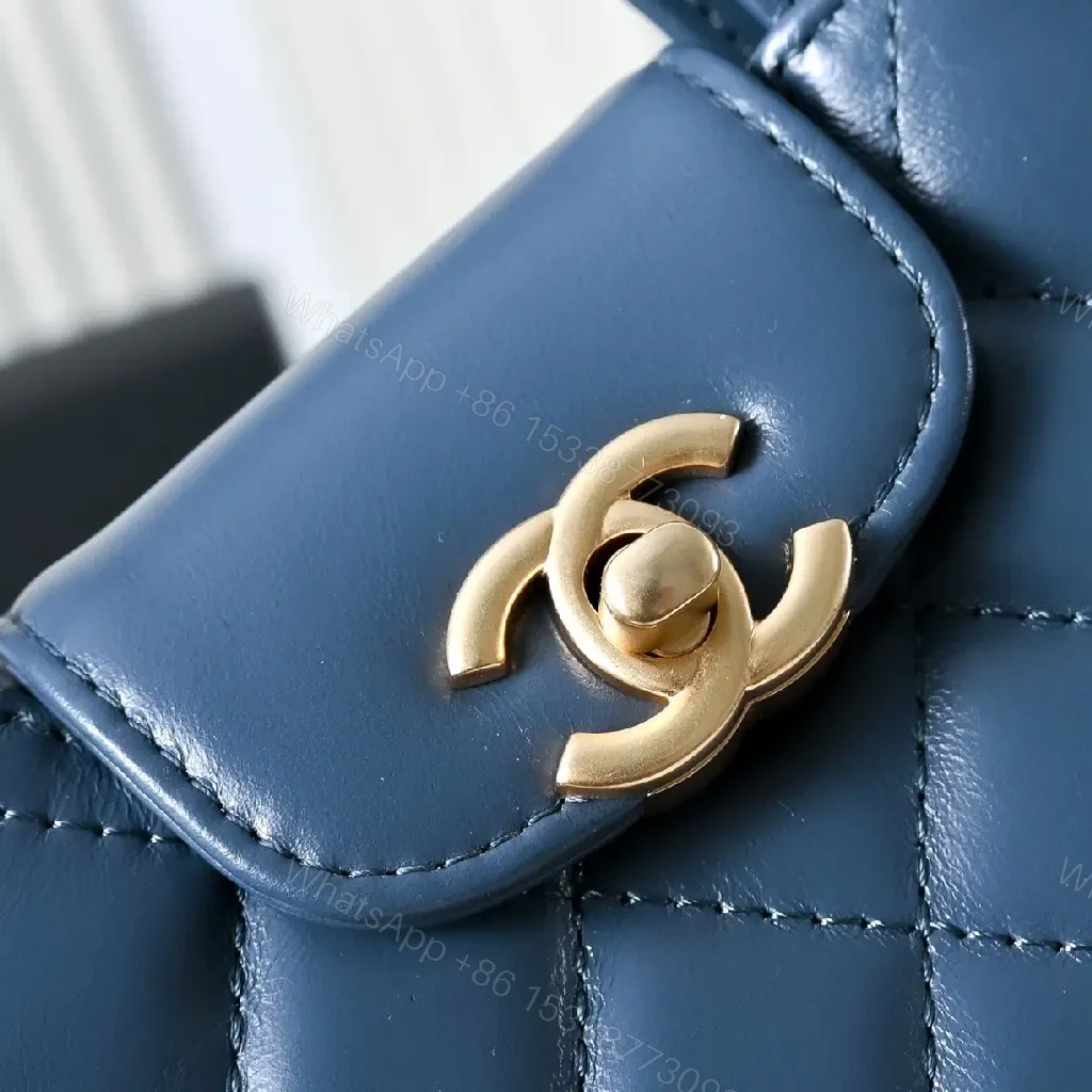 View 2 of Compact Blue Quilted Satchel with Gold Clasp Bag