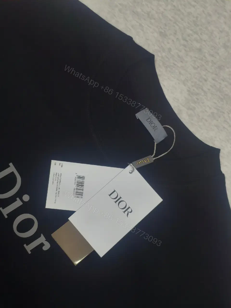 View 10 of Minimalist Black Knit Tee with Dior Logo Print, Unisex Fit